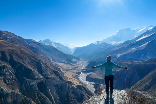 istock Nepal - Girl spreads her hands wide, Manang Valley 1135164844