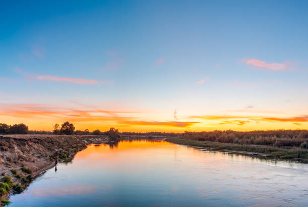 istock Beautiful horizon over the river at sunset time 1135164911