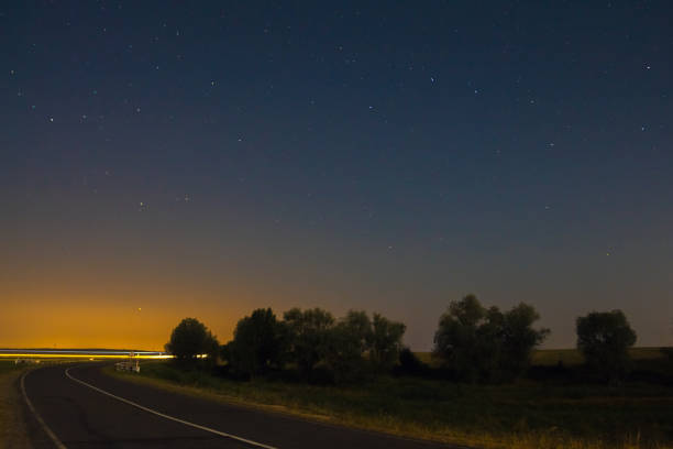 istock Night with a road and a starry sky 1135164939