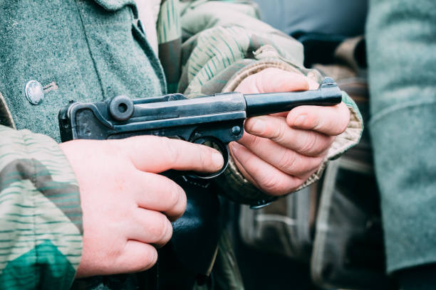 istock Parabellum pistol in hands 1135164959