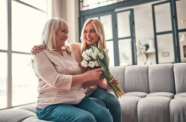 istock Mother with daughter at home 1135165356