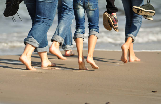 istock A group of people walk along the stand 1135166522