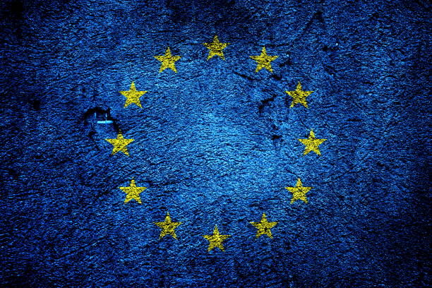 istock eu flag on grunged and cracked background 1135168195