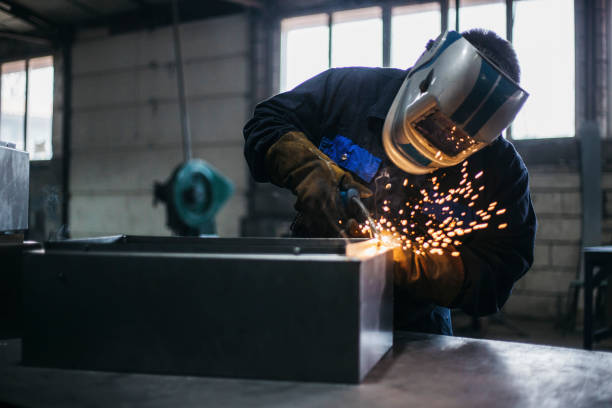 Industrial Welder With Torch stock photo