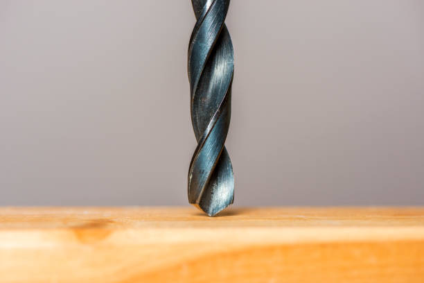 istock drilling a hole in a wooden plank 1135169578