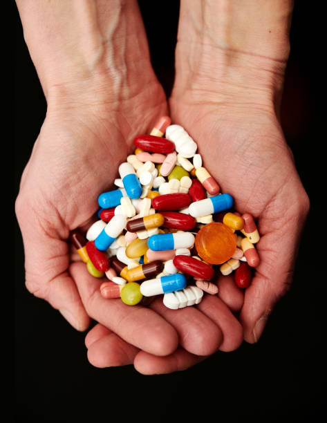 two-hands-full-of-tablets-and-pills.jpg