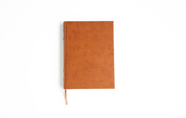 libro di pelle marrone isolato su bianco - brown book foto e immagini stock