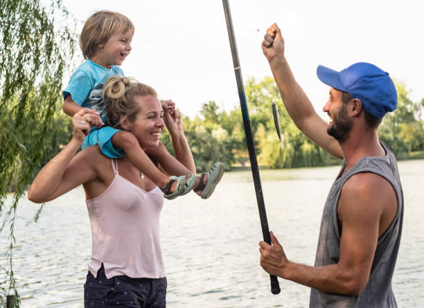 istock Happy family caught a fish 1135173207