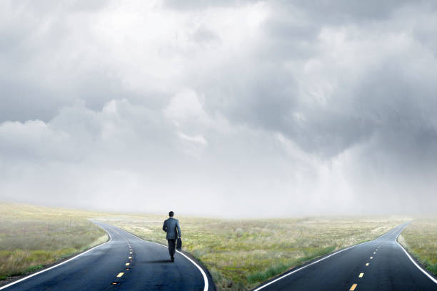 istock Businessman Makes A Decision At A Fork In The Road 1135173412