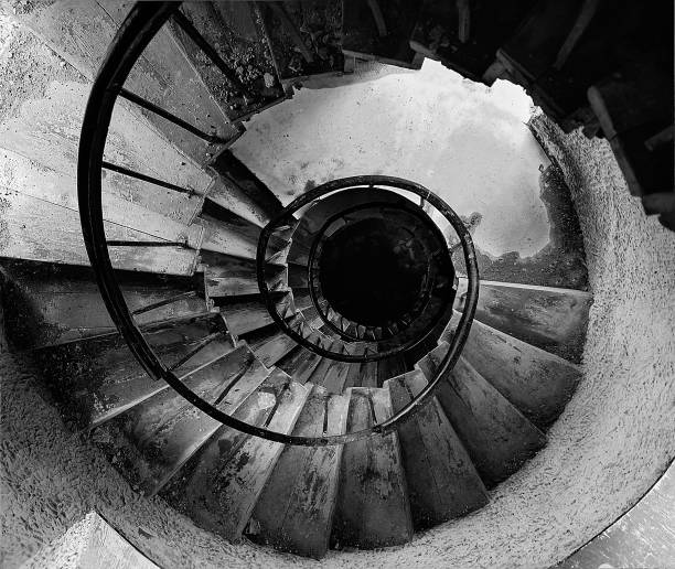 istock Old spiral staircase, monochrome. 1135173488