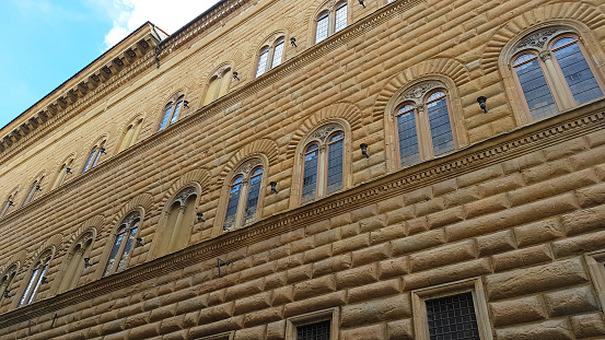 Florence, Italy - March, 2019. View of the Palazzo Strozzi facade in Florence, Tuscany, Italy