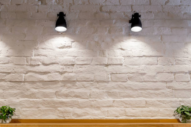 white brick room with wall lamp