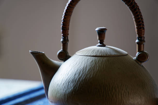 istock Old antique brass teapot on table, close-up image 1135176927