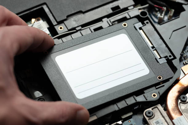 istock installing new solid-state drive to laptop pc. sata and power connection close up.upgrade laptop hardware. 1135180727