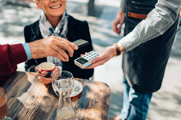 istock Man paying contactless with smart phone 1135181561