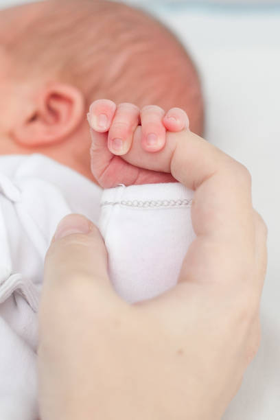 istock the newborn's palm 1135183215