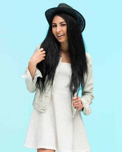 istock Trendy cute latino female on blue background 1135183496