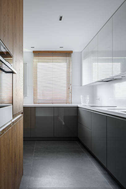 istock Simple kitchen with wooden blinds 1135184983