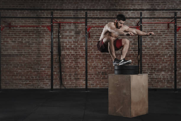 istock Athlete doing box jump exercise at the gym 1135186839