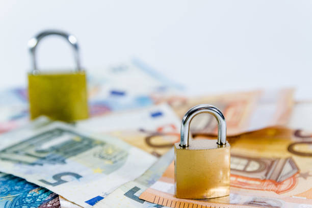 istock Money Euro value banknotes with padlock, European Union payment system 1135187510