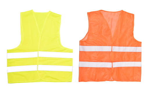 Safety orange vest isolated on a white background. Road vest for safe work.  Safety clothing with reflective stripes. Front side.  Isolated on white background