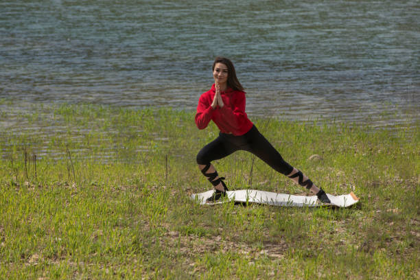 Fitness in nature, outdoor yoga practicing