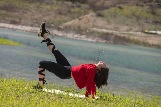 istock Fitness in nature, outdoor yoga practicing 1135189746