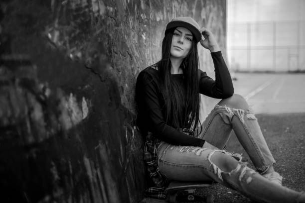 istock Beautiful woman resting on a skateboard 1135192825