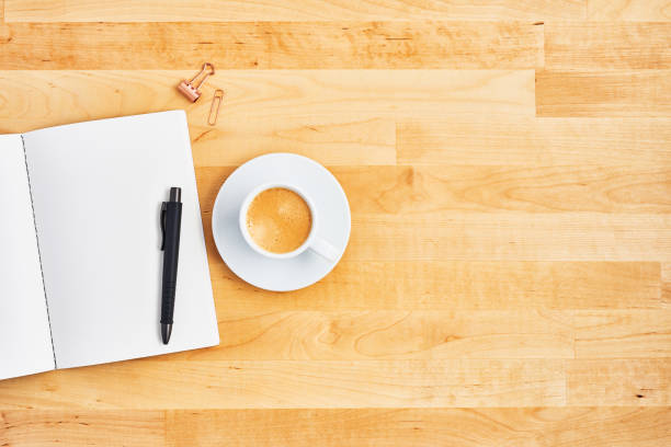 istock Office desk with blank notebook, pen and cup of coffee 1135193051