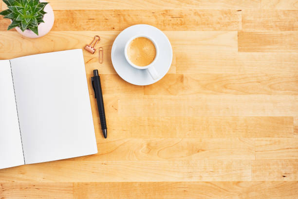 istock Office desk with blank notebook, pen and cup of coffee 1135193183