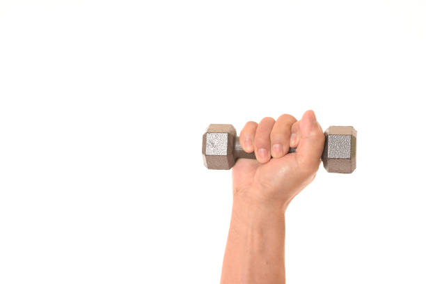 istock Dumbbell and senior hand 1135194016