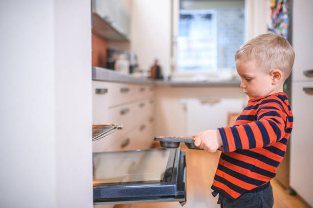 istock Boy baking muffins at home 1135194248
