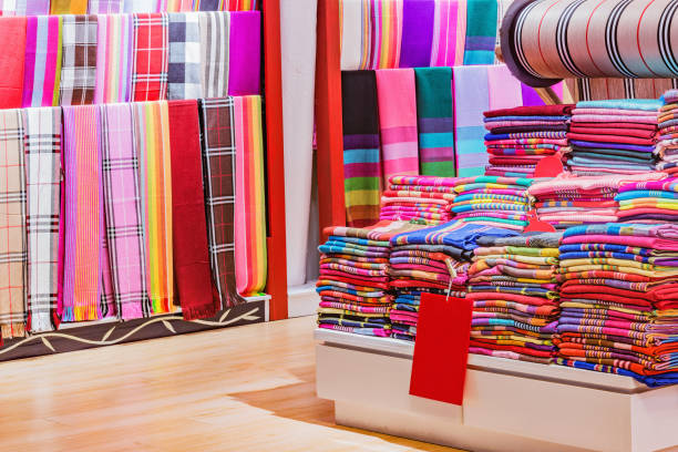 istock Clothes on the shelves in the textile shop. 1135194935