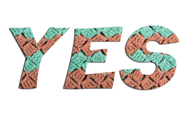 istock YES  word with  hand knitted texture on white background 1135195407