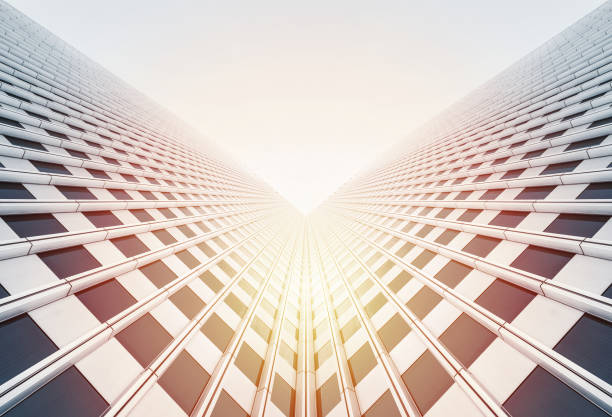 looking up view of skyscrapers reflect blue sky