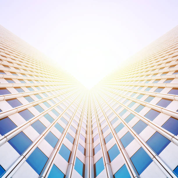 istock looking up view of skyscrapers reflect blue sky 1135197543