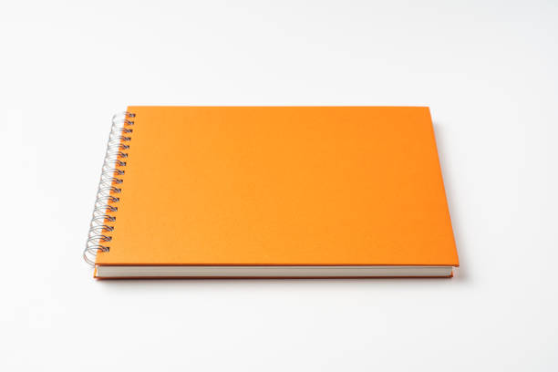 istock perspective view of spiral orange notebook 1135197638