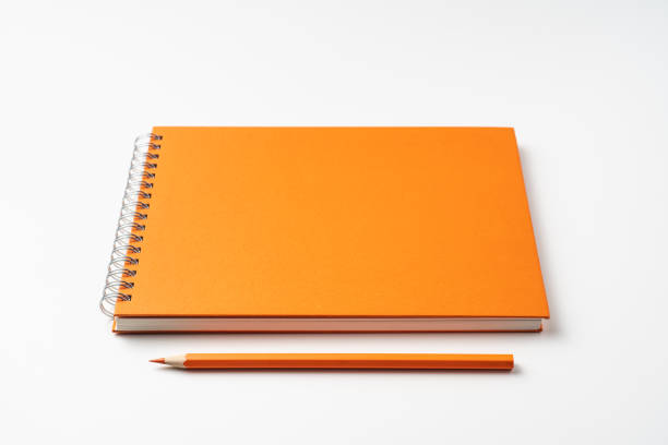 istock perspective view of spiral orange notebook 1135197659