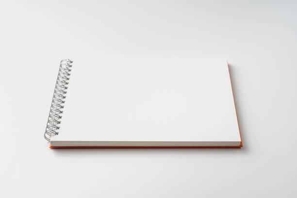 istock perspective view of spiral orange notebook 1135197664
