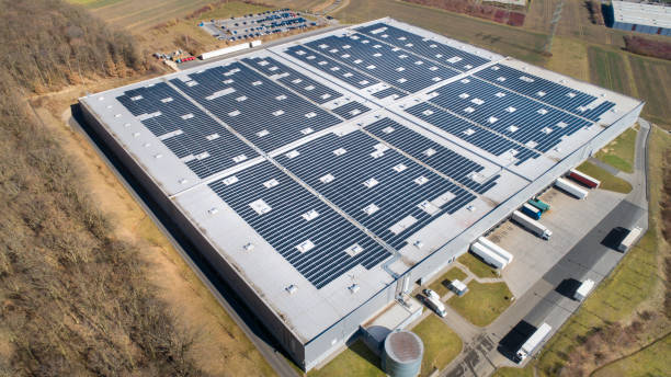 istock Large industrial building, solar panels and trucks 1135200796