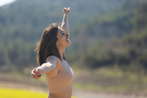 Fitness in nature, outdoor yoga practicing