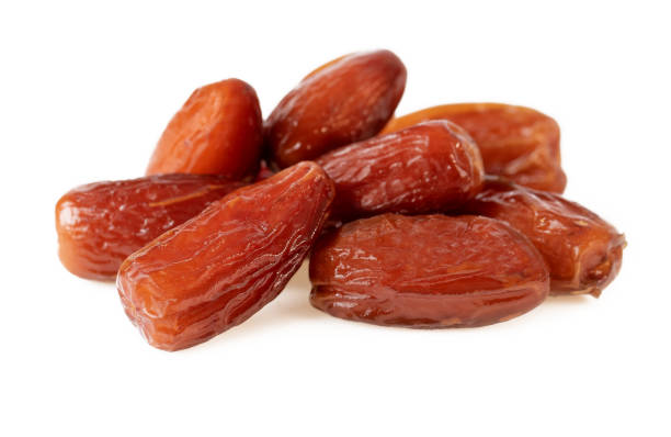 istock Dates Fruit. Pile of Dried Dates On White 1135201561