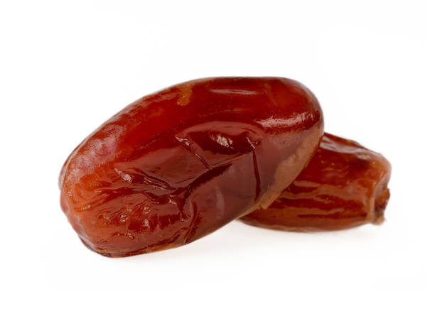 istock Sweet Dried Dates Two Date Fruits On White Closeup 1135201761