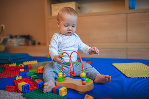 istock Little boy playing in living room 1135201800