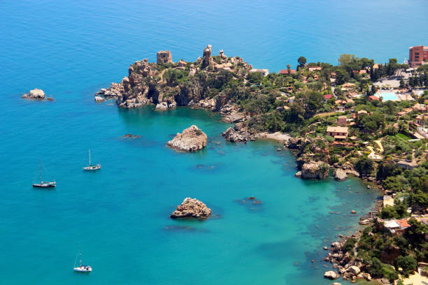 Rocky seacoast and beaches of Cefalu and beautiful Mediterranean sea on Sicily, Italy