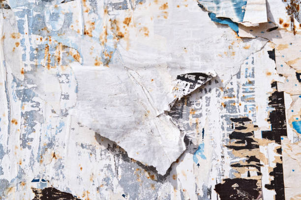 istock The texture of a wall with torn posters and ads. Bright abstract background ideal for any design 1135210238