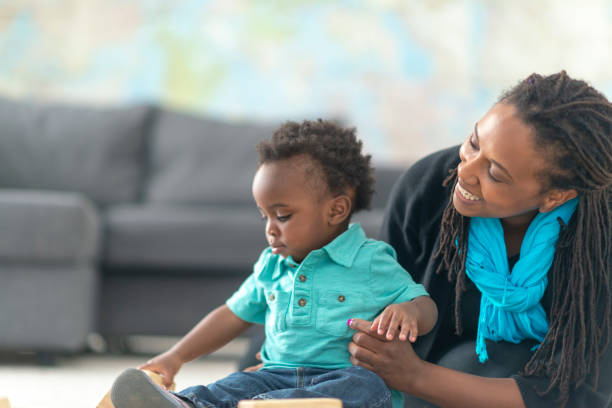 istock Single mother plays with her toddler 1135210376