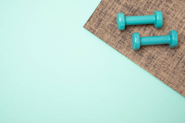 istock Mats for fitness classes and dumbbells. Top flat lay 1135210664