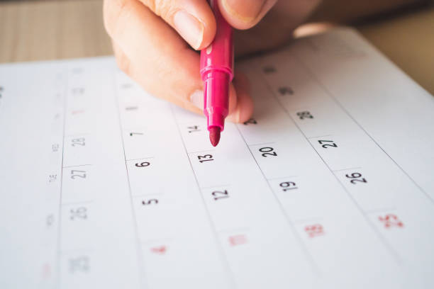 istock Hand with pen writing on calendar page closeup 1135210710