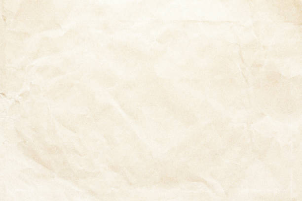 istock Crumpled old brown paper background texture 1135210738